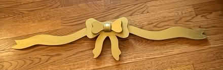 Photo of free Gold Wood Bow (Woodbridge) #1