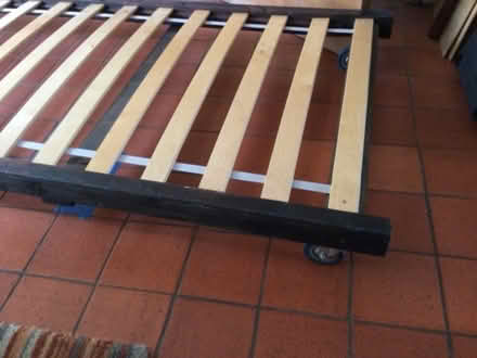 Photo of free Low level single (2'6" wide x 6'3") bed on wheels (islington N1) #1