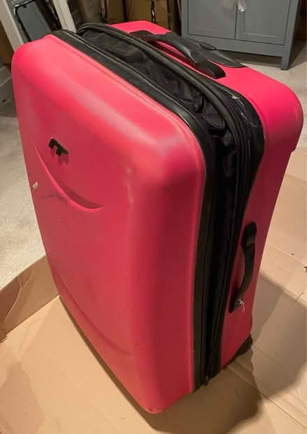 Photo of free Large pink suitcase (Hampton Peterborough) #1