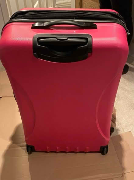 Photo of free Large pink suitcase (Hampton Peterborough) #2