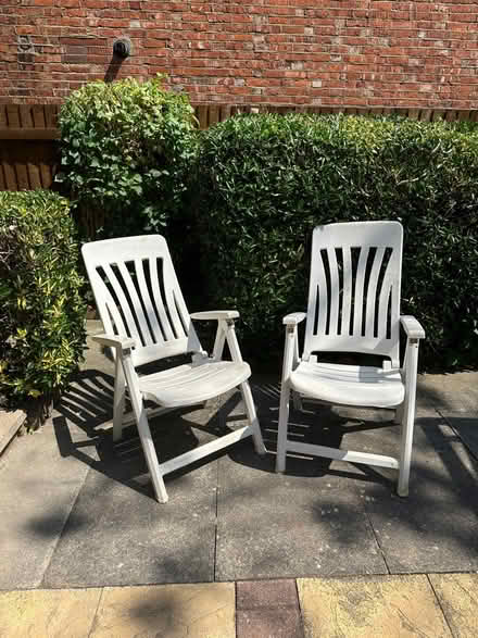 Photo of free White plastic garden chairs (Colliers Wood) #1