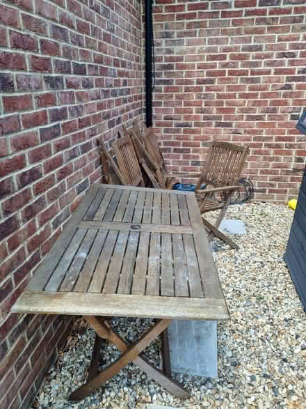 Photo of free Outdoor wooden table 4 chairs (CR8) #1