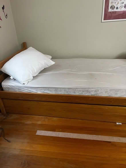 Photo of free Wood twin trundle bed frame only (13 btw Woodward & greenfield) #1