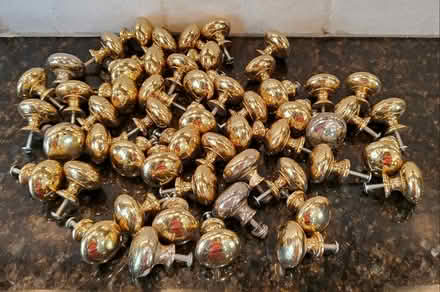 Photo of free Qty 54 Brass ? Metal Cabinet Pulls (Brookhaven) #1
