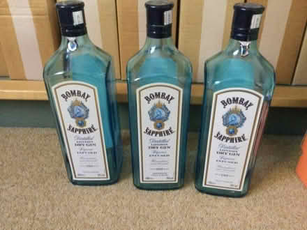 Photo of free Three decorative gin bottles (blue) (Nine Elms SN5) #1