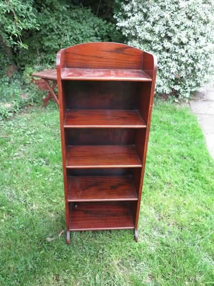 Photo of free Small dark wood bookcase/DVD Storage Unit (Bunwell NR16) #1