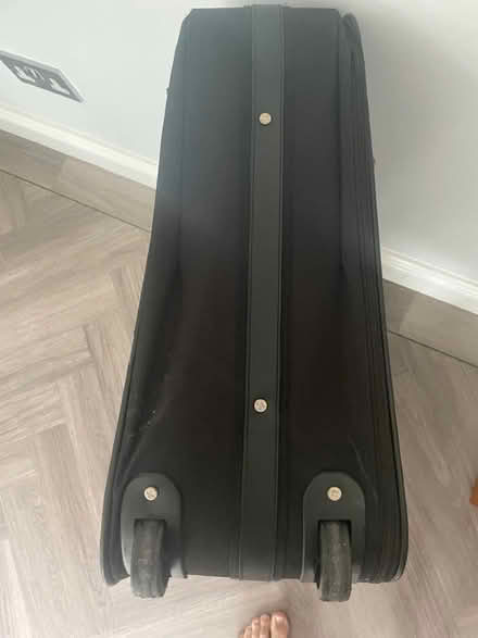 Photo of free Black roller suitcase (Hinchley Wood KT10) #1