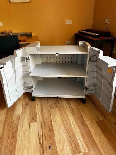 Photo of free Metal/plastic store cabinet on wheels (Lupton LA6) #1