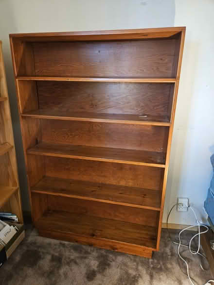 Photo of free Tall wood shelves (West Seattle) #1