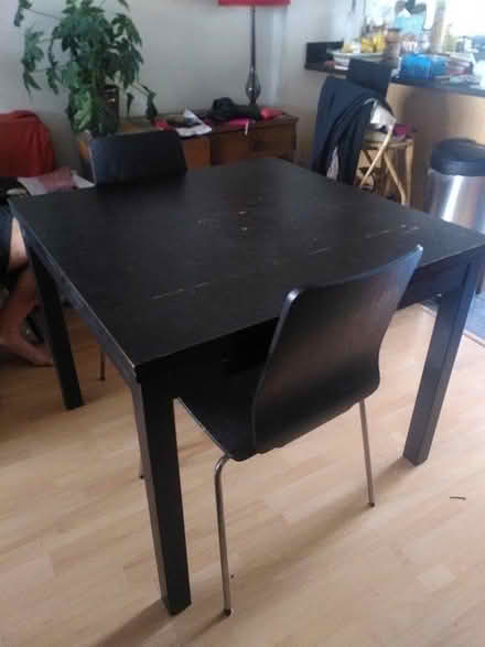 Photo of free Black ikea dining table + 2 chairs (N7 Holloway Road) #1