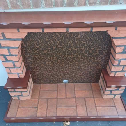 Photo of free Mahogany fireplace & heater (Northside) #1