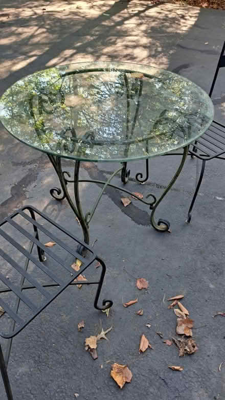 Photo of free Outdoor glass patio table & chairs (Fairfax Station) #1