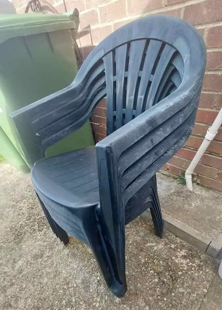 Photo of free 4 plastic dark green garden chairs (Seaford BN25) #2
