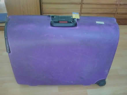 Photo of free Large purple suicase (Horsell, Woking) #2