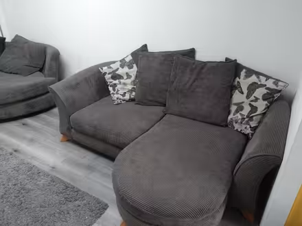 Photo of free 2 large grey fabric sofas smke (East grinstead, Furzefield) #1