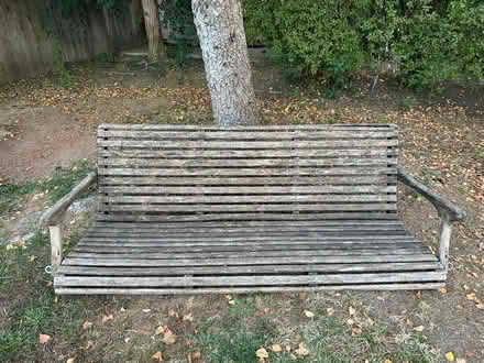 Photo of free Worn wooden backyard bench swing (South Davis) #1