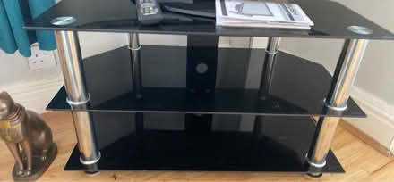 Photo of free Black glass tv table (PR8 Birkdale) #1