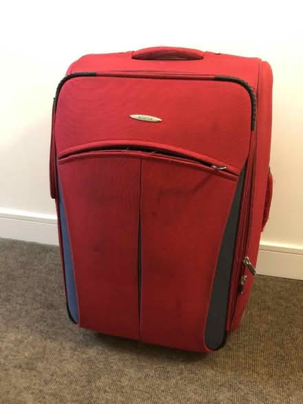 Photo of free Large red suitcase (Dun Laoghaire, Dublin) #1