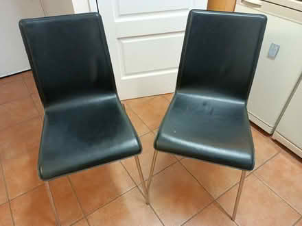 Photo of free Two black leather dining chairs (Saltaire BD18) #1