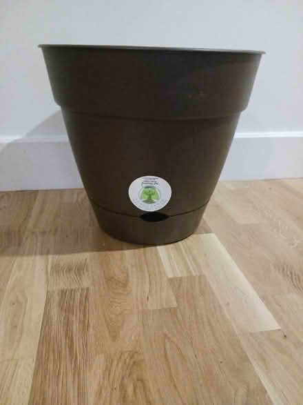 Photo of free Brown plastic self watering planter (Lefferts Gardens) #1