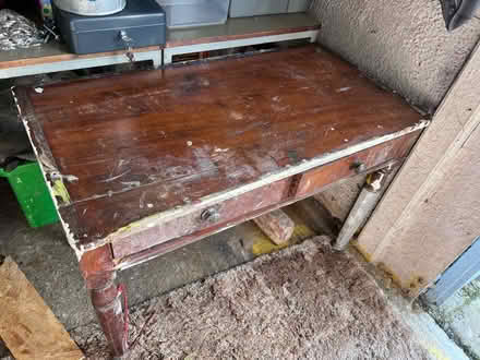 Photo of free Battered old table with drawers (TW16) #1