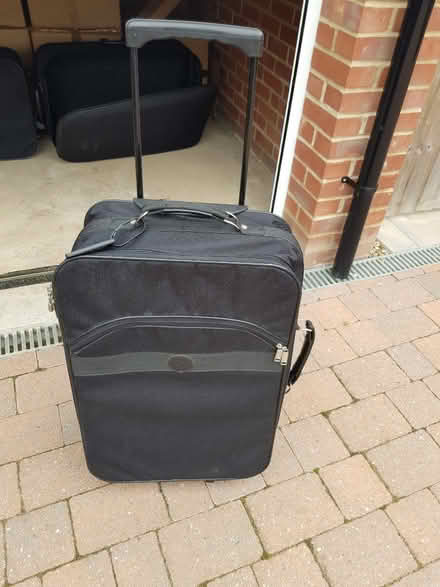 Photo of free Medium and large travel suitcases. 2 wheels (Meppershall SG17) #1