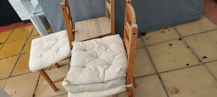 Photo of free 4 wooden chairs with cushions (SW18) #1