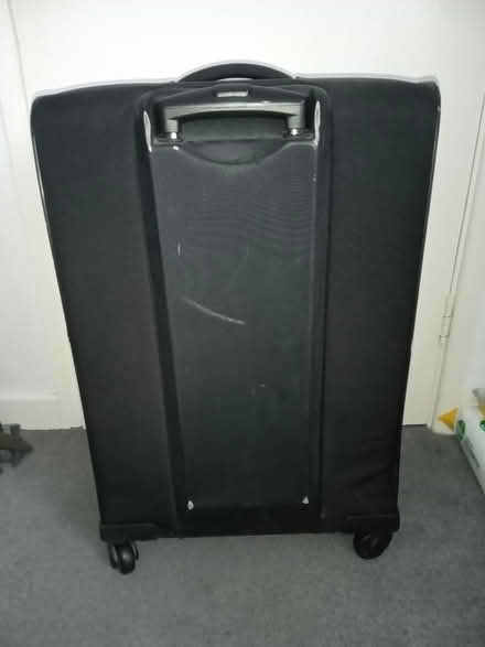 Photo of free Black suitcase (Surrey Heath GU15) #1