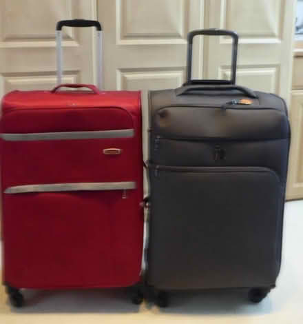 Photo of free medium size travel luggages, on rollers. (Marazion TR17) #1