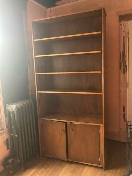 Photo of free Tall wood book case (East Village (Mack & Van Dyke)) #1