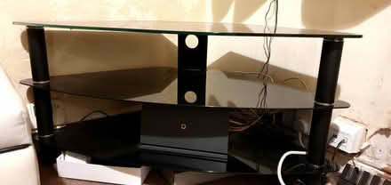 Photo of free TV Stand - black glass (Heeley Bridge S8) #1