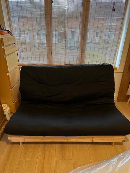 Photo of free Wooden futon with black cushion (Stirchley) #1