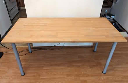 Photo of free Wooden table with steel legs (Near downtown Sunnyvale) #1
