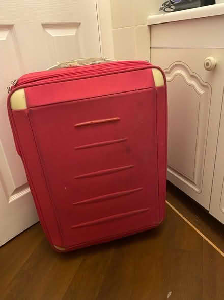 Photo of free Pink large suitcase (L38) #1