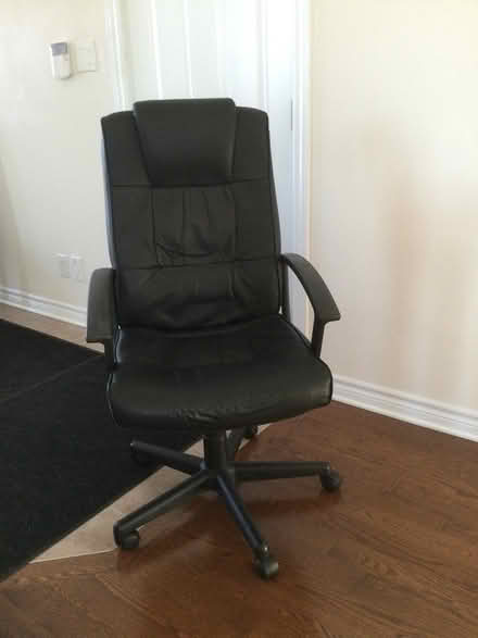 Photo of free Black vinyl office swivel chair (Stittsville) #1