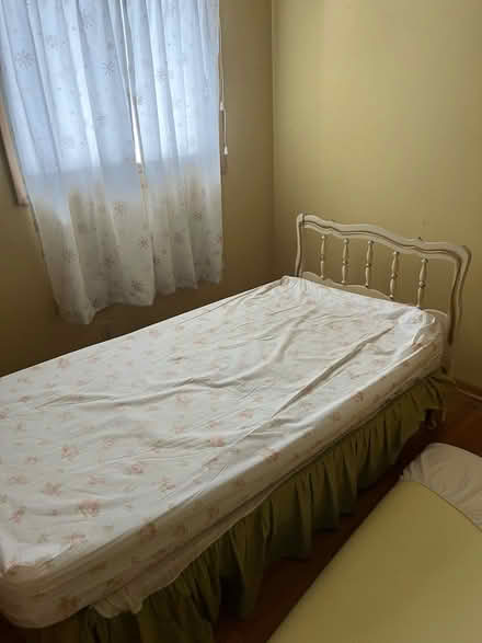 Photo of free Twin size bed with headboard (7 Hills) #1