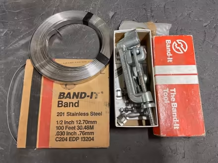 Photo of free ‘Band-it’ tool, 2 lengths of steel strap & buckles. (Lodge Moor S10) #1