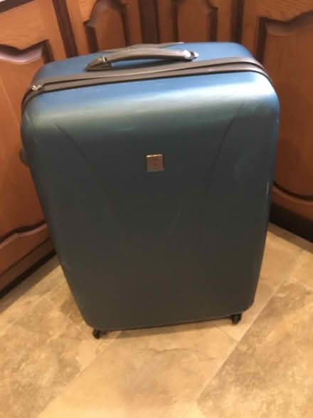 Photo of free Tripp large, hardbodied, teal 4 wheeled suitcase. (Uxbridge UB10) #1
