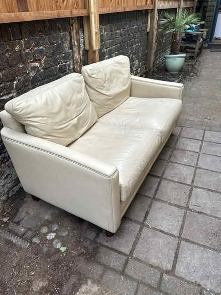 Photo of free 2 seater cream leather sofa (chiswick) #1