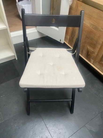Photo of free Black folding chair with cream cushion (Chiswick W4) #1