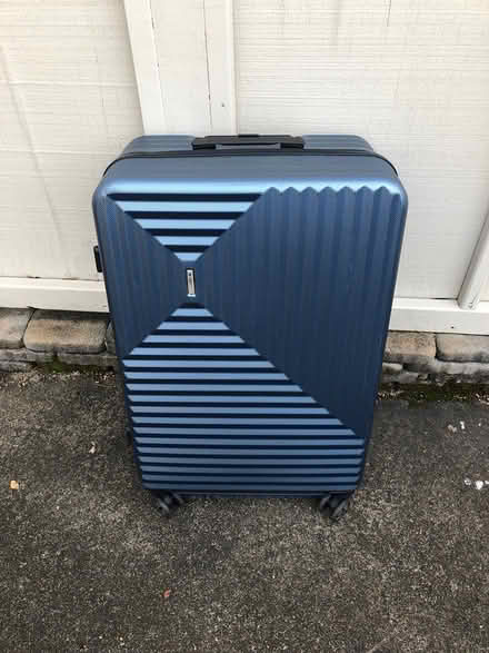 Photo of free Large suitcase (Four Seasons) #1