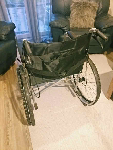 Photo of free Manual Wheelchair • Folding, steel, w/ bedpan option (Fletton) #2