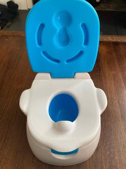 Photo of free Munchkin potty (Downtown Frederick) #1