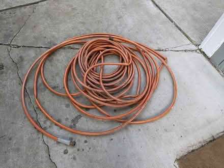 Photo of free Orange Garden Hose - 100ft (Dixboro) #1