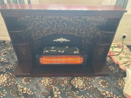 Photo of free 2 bar electric fire in a decorative mahogany surround (Longton PR4) #1