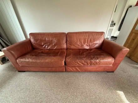 Photo of free Large tan leather sofa (Eastbourne) #1