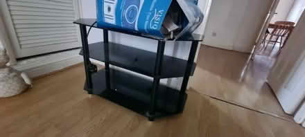 Photo of free Black glass TV stand (Saltney CH4) #1