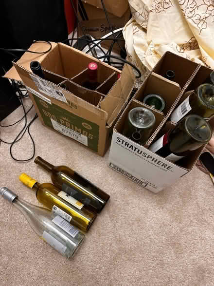 Photo of free A dozen wine bottles Various colors (Hwy 101 South toward Woodruff) #1