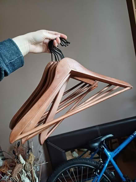 Photo of free 8 wooden hangers (Stretford M32) #1