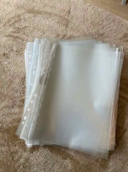 Photo of free A4 punched pocket transparent plastic file sleeves (St Pauls Ward GU15) #1